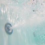 Empava 59" Freestanding Whirlpool Tub with Center Drain,Stand Alone Bathtub with 8 Hydromassage Jets, Boat-Shaped Design,Acrylic,ETL Certificated