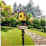 Yellow Wooden Birdhouse with Pole for Outdoor Use