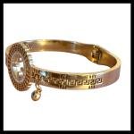 Gold Tone Evil Eye Charm Bangle with Greek Key