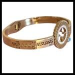 Gold Tone Evil Eye Charm Bangle with Greek Key