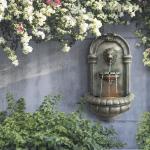 Lion Head Stone Wall-Mounted LED Water Fountain