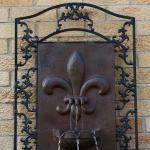 Sunnydaze French Lily Polystone Outdoor Solar Wall Fountain, Iron Finish