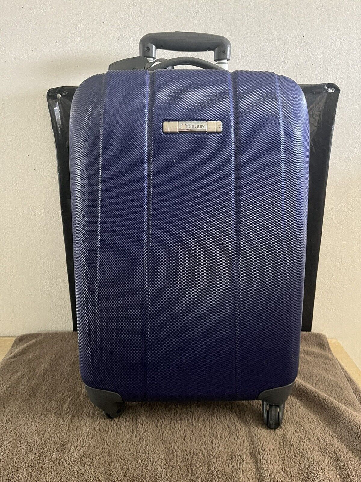 Lightweight Hardside Rolling Suitcase by DELSEY