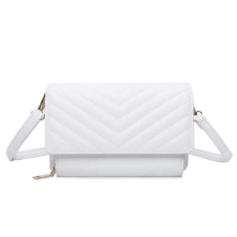 Small white designer handbag with three compartments and flap