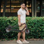 Caroma Electric Scooter Adults, Peak 630W Motor, 8.5" Big Tires, 18 Miles Range & 16 MPH, Disc Braking System and Cruise Control, Foldable Electric Scooter Adults, IP54 Waterproof(Black)