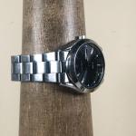 Seiko Men V1580AB0 Fashion Day Date Silver Tone Solar Analog 37mm Watch  G2U