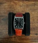 Solar powered water resistant Seiko watch, with brown, silver, and black colors