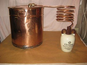 Antique Copper Moonshine Still with Glenmore Whiskey Jug