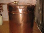 Antique Copper Moonshine Still with Glenmore Whiskey Jug