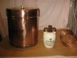 Antique Copper Moonshine Still with Glenmore Whiskey Jug
