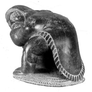 Large Inuit Soapstone Carving of an Eskimo with a Seal - Signed