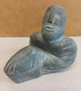 Inuit Soapstone Man Holding Rock Carving