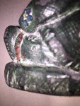 Inuit Woman Carving in Parka with Flowers