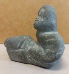 Inuit Soapstone Carving: Man Holding Rock