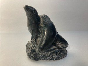 Hand-Carved Soapstone Wolf Sculpture on Rock