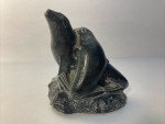 Hand-Carved Soapstone Wolf Sculpture on Rock