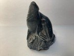 Hand-Carved Soapstone Wolf Sculpture on Rock