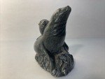 Hand-Carved Soapstone Wolf Sculpture on Rock