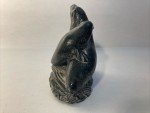 Hand-Carved Soapstone Wolf Sculpture on Rock