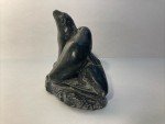 Hand-Carved Soapstone Wolf Sculpture on Rock