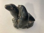 Hand-Carved Soapstone Wolf Sculpture on Rock