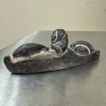 Inuit Stone Carving: Man in Canoe with Seal