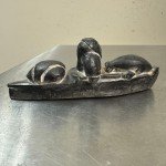 Inuit Stone Carving: Man in Canoe with Seal
