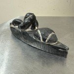 Inuit Stone Carving: Man in Canoe with Seal