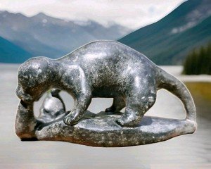 Handcrafted Inuit Stone Sculpture: Signed Wolverine with Salmon