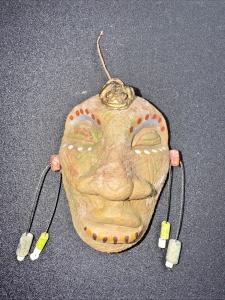 Stone Carved Face with Brass Frog Decoration