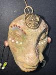 Stone Carved Face with Brass Frog Decoration