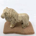 Hand Carved Lion Figurine with Sandstone Base