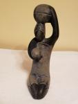 Hand-Carved Inuit Stone Sculpture of Woman with Baskets