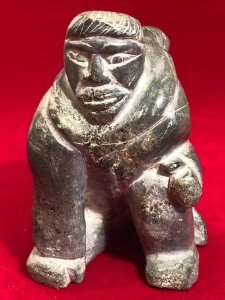 Inuit Soapstone Carving: Man and Seal Design