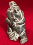 Inuit Soapstone Carving: Man and Seal Design