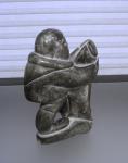 Inuit Soapstone Carving of Man with Seal