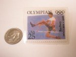 Olympics 25 Cent Ray Ewry Stamp Lapel Pin