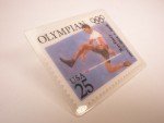 Olympics 25 Cent Ray Ewry Stamp Lapel Pin