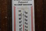 Thompson Tomahawk Hybrid Vintage Metal Thermometer Sign