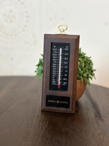 Vintage GE Advertising Thermometer with Faux Wood