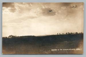 Aviator in Clouds: 1910s Antique Airplane Photo