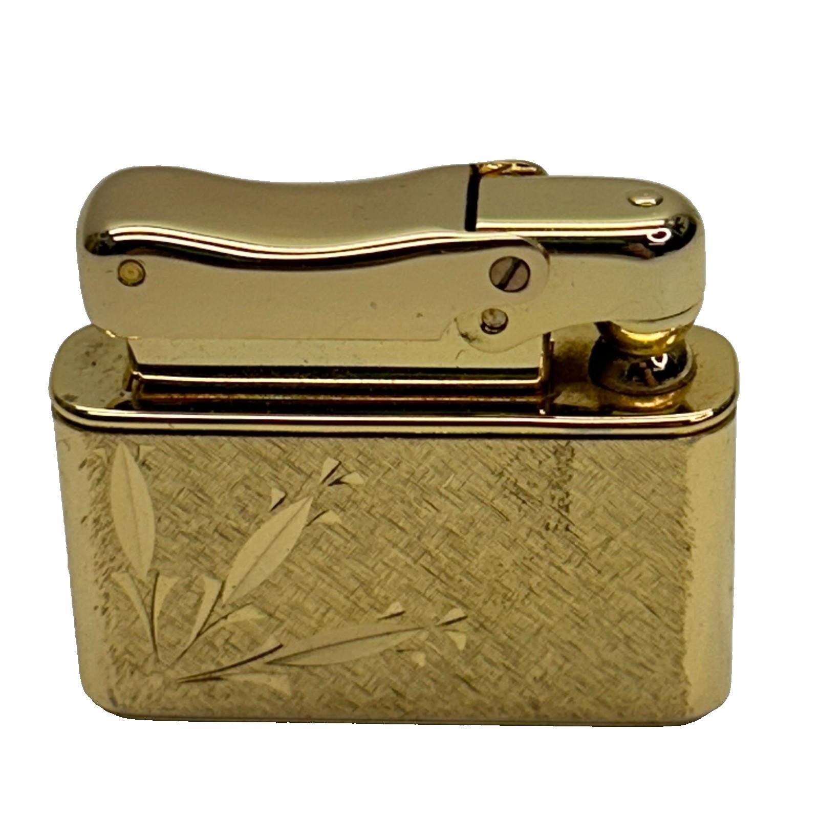 Colibri Gold Tone Pocket Lighter with Engraved Design