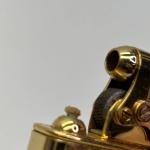 Colibri Gold Tone Pocket Lighter with Engraved Design