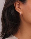 Sparkling Moissanite Huggie Earrings in White Gold
