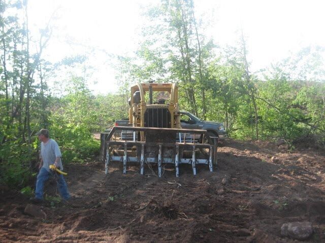 CATERPILLAR D7E bulldozer with dual blades and rake