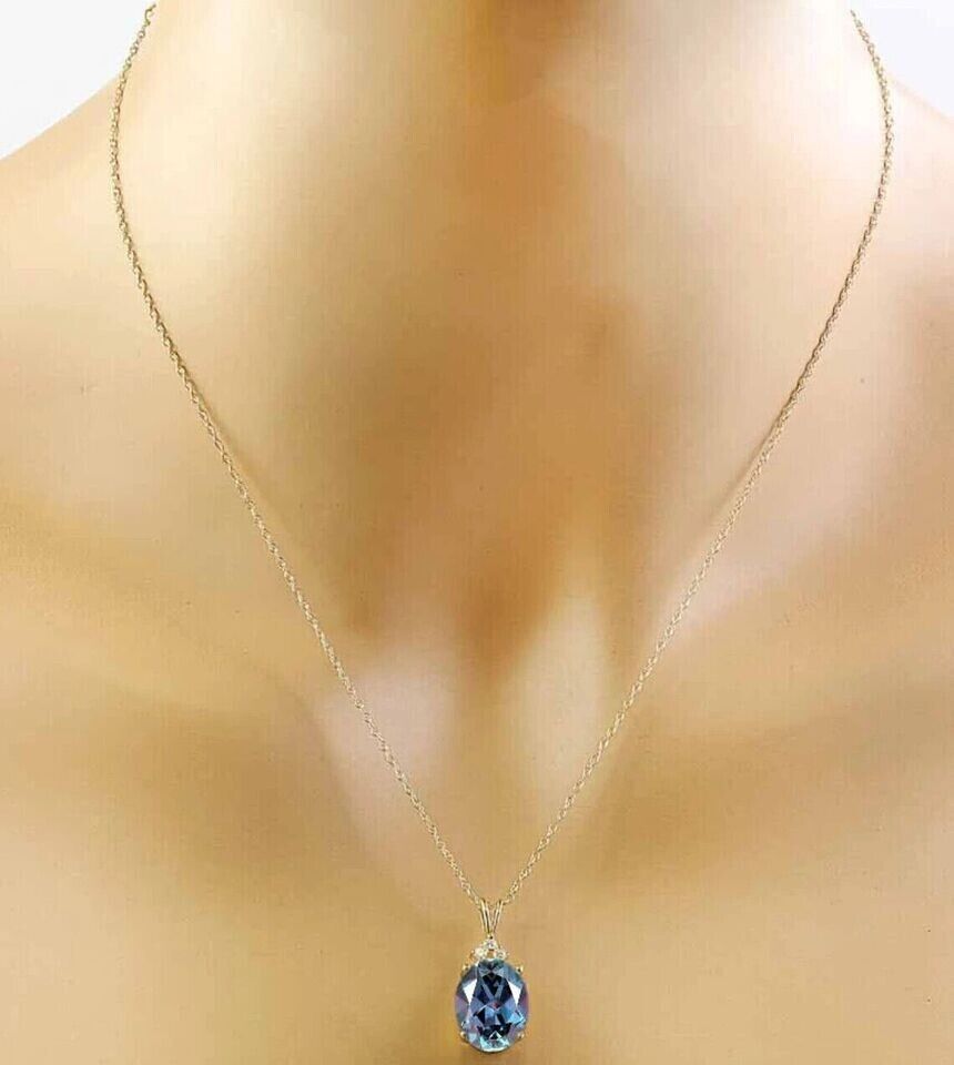 Lab created Alexandrite diamond pendant in 14K gold