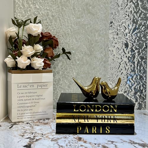 Modern Coffee Table Decor: Stacked Books with Bird Statues