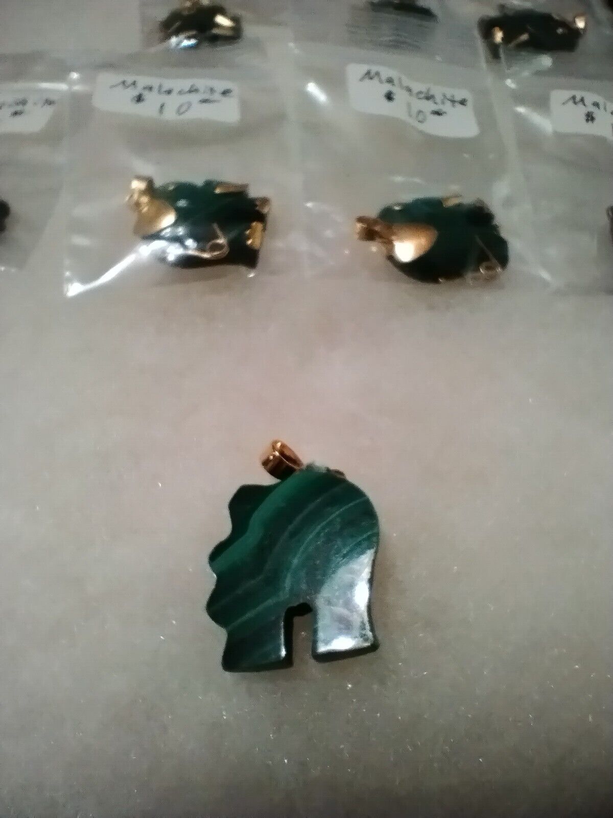 Gold-accented Malachite Elephant Pendant in Gemstone Jewelry niche