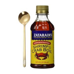 Gold Stainless Steel Spoon and Seafood Boil Liquid