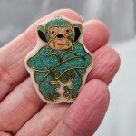 Vintage Bakelite? Plastic Brooch Turquoise Sitting Monkey Golden Outline Scarf